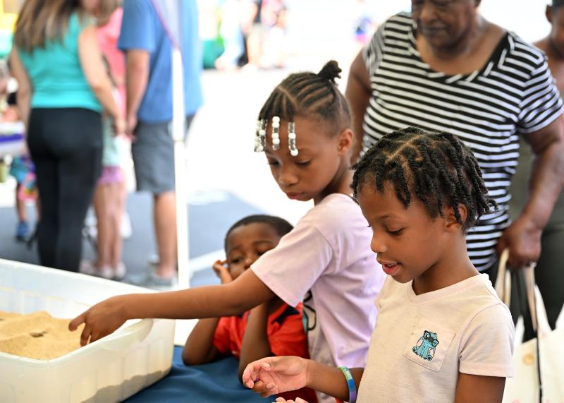 Attending the event from Gumboro are (l-r) Donvan, 4; Amilah, 7; and Harlem Sample, 6; along with Doris Sample (in back).